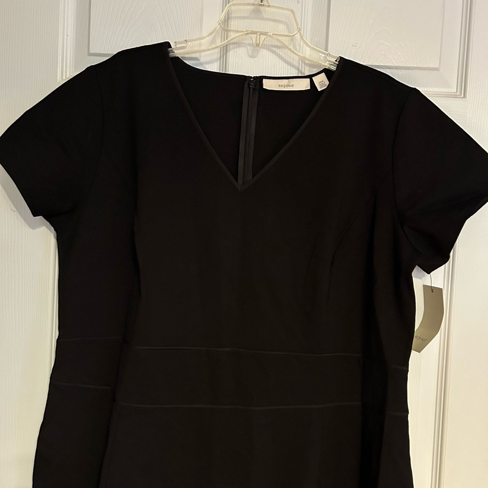 Beautiful classy black dress, brand new with tags.